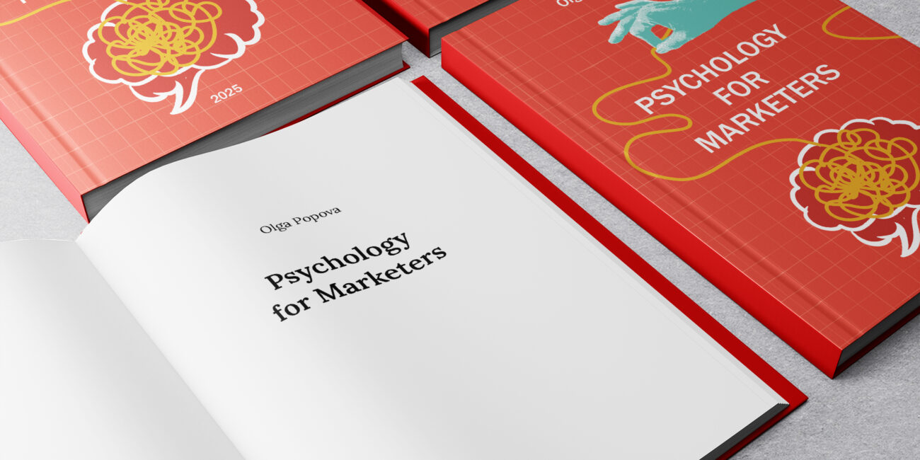 Psychology for Marketers book cover held in hands